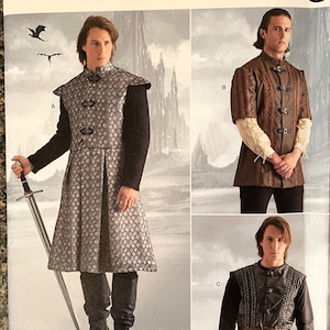 May include: A sewing pattern for three different costumes. The pattern is for a medieval-style tunic with a long, flowing skirt, a shorter tunic with a more fitted style, and a vest with a belt. The pattern is from Simplicity and is labeled R11856.