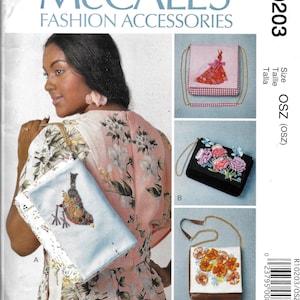 May include: McCall's Fashion Accessories pattern featuring four different purse designs. The purses are decorated with embroidered flowers, a dress design, and button embellishments. The pattern includes the size OSZ.