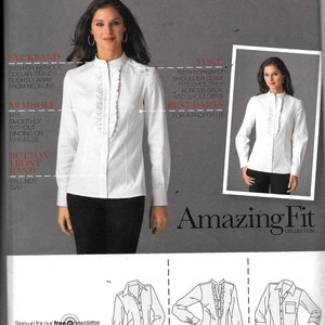 May include: A sewing pattern for a white blouse with a ruffled neckline. The pattern includes three different views: a classic button-up shirt, a shirt with a ruffled neckline, and a shirt with a ruffled neckline and a pocket. The pattern is from Simplicity's Amazing Fit Collection.