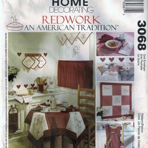 May include: A sewing pattern for a redwork embroidery project. The pattern includes instructions for making a table runner, placemats, an envelope, and a kitchen apron. The pattern is titled "Redwork: An American Tradition".