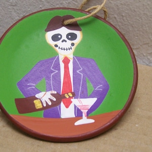 De dödas dag målad lertallriksprydnad - skelettbartender