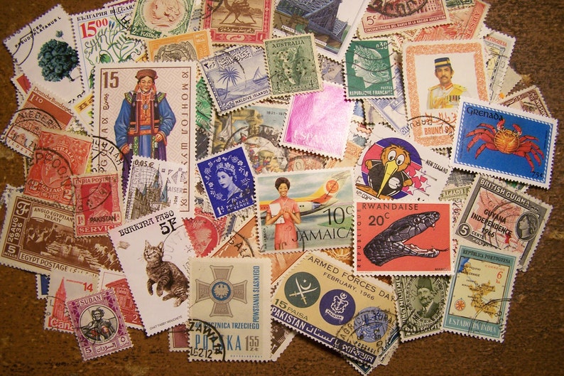 May include: A collection of colorful postage stamps from around the world. The stamps feature a variety of designs, including animals, flags, and historical figures. Some of the stamps are from countries such as Jamaica, Grenada, and Rwanda.