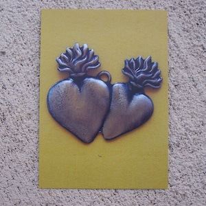 Zestaw 12 pocztówek z obrazkami Twin Sacred Hearts Milagro