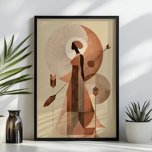 May include: Framed art print featuring a geometric illustration of a woman in a long dress, with a crescent moon and sun design in shades of brown and beige. The artwork includes arrows and geometric shapes, creating a modern, abstract aesthetic.