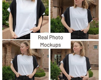 May include: A collage of four images featuring a white t-shirt. The t-shirt is paired with black jeans and a black sweater draped over the shoulders. The text "Real Photo Mockups" is displayed in a white box.
