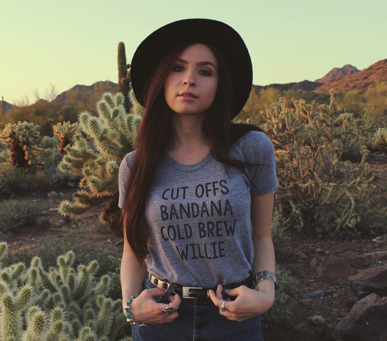 Grey womens and unisex top. Says Cut Offs Bandana Cold Brew Willie.  Inspired by our love of Willie Nelson.