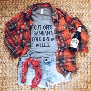 Grey womens and unisex top. Says Cut Offs Bandana Cold Brew Willie.  Inspired by our love of Willie Nelson.