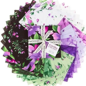 May include: A collection of fabric squares in various floral patterns and colors, including purple, green, and white. The squares are arranged in a circular pattern, with a central bundle tied with a ribbon that reads "Maywood Studio". The label reads "Catalina Ultra Violet".