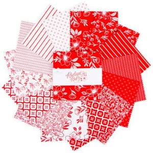 May include: A collection of red and white fabric squares arranged in a circular pattern. The fabric features various patterns, including floral designs, stripes, and geometric shapes. The center square has the text "Radiant Ruby".