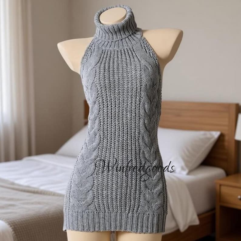 May include: A gray, sleeveless turtleneck sweater dress with a cable knit design. The dress is displayed on a mannequin. The text "Winpedgoods" is visible on the front of the dress.
