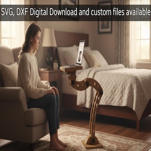 May include: A wooden laptop stand with a curved, adjustable design. The stand has a small platform for the laptop and a base for stability. The text "SVG, DXF Digital Download and custom files available" is at the top of the image.