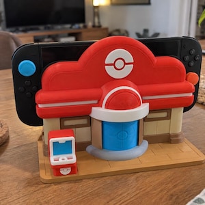 Pokopia Center Nintendo Switch 1 & 2 dockningshållare | 3D-utskriven Pokémon-dockningsstation | Switch-ställ | Spelbordsorganisatör | 6 färger