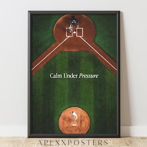 May include: A framed vertical poster featuring an aerial view of a baseball field with a pitcher on the mound and a batter at home plate. The text Calm Under Pressure is printed in white in the center. The frame is black and rectangular.