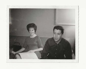 1960s Couple in Lounge Snapshot | Vintage Polaroid Photo | Smiling Woman with Newspaper | Found Wall