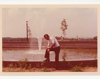 1970s Kodak Photo: Man Posing by Fountain - Vintage Snapshot