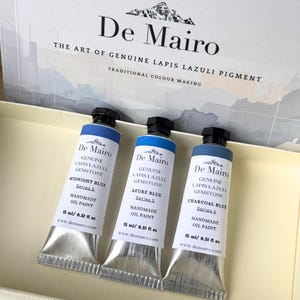 Three De Mairo Sare Sang Blue oil paint tubes displayed in premium gemstone artist paint packaging.