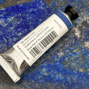 Back view of De Mairo Sare Sang Blue 15ml oil paint tube showing batch number and bar code.