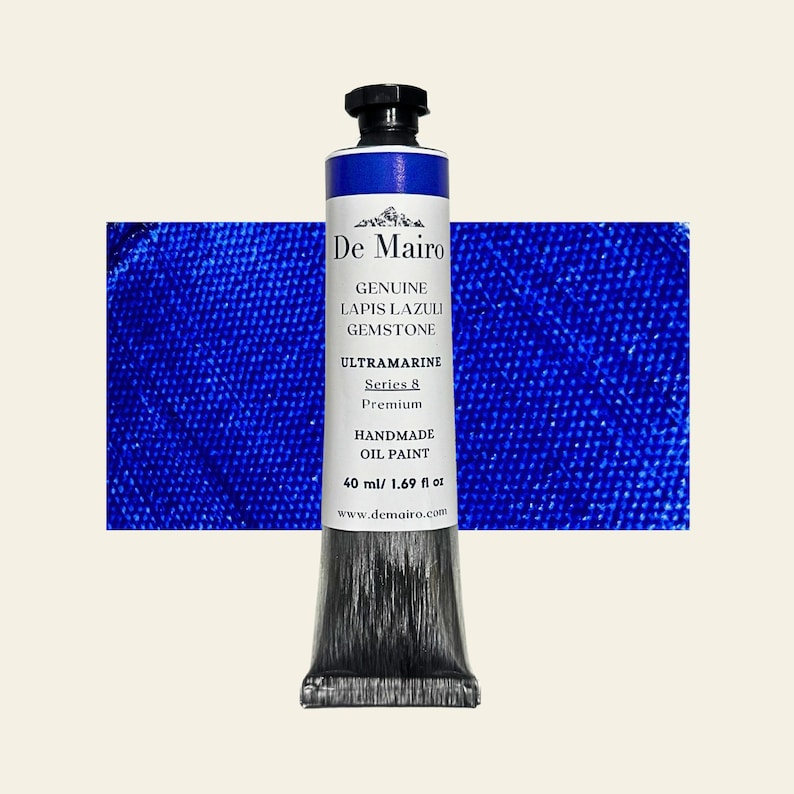 May include: A tube of De Mairo handmade oil paint, featuring a deep ultramarine blue color. The label indicates it's Series 8, made with genuine Lapis Lazuli gemstone. The tube contains 1.69 fl oz (40 ml) of paint.