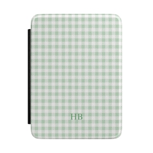 May include: A rectangular case with a light green and white gingham pattern. The case has a black spine and the initials "HB" in the lower center. The case is likely for a tablet or e-reader.