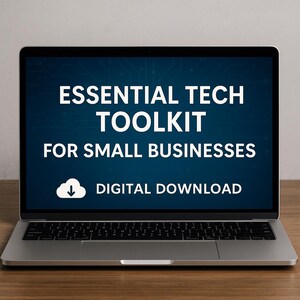 May include: A silver laptop displaying the text "ESSENTIAL TECH TOOLKIT FOR SMALL BUSINESSES" in white letters on a dark blue background. Below the text is a white cloud icon with a downward arrow, and the words "DIGITAL DOWNLOAD". The laptop sits on a wooden surface.