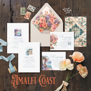 May include: A wedding stationery set featuring white cards with watercolor illustrations of coastal scenes, floral motifs, and elegant script text. Includes an envelope with a floral interior, a patterned card, postage stamps, and a light blue ribbon.
