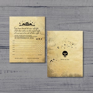 May include: A black and white wedding invitation with a skull and crossbones design. The invitation features a vintage style font and a text that reads "Come dance beneath the stars' soft light, And share with us in this magical night, As we toast to love and all that's right." The invitation also includes an RSVP section with a list of entrees and a space for guests to indicate their choice.