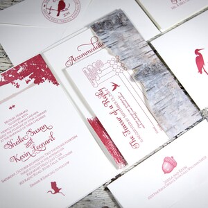 May include: A wedding invitation suite featuring white cardstock with deep red text and graphics. The set includes a main invitation for Sheila Susan and Kevin Leonard, a reply card with a birch tree bark pattern, and envelopes with acorn and bird motifs.