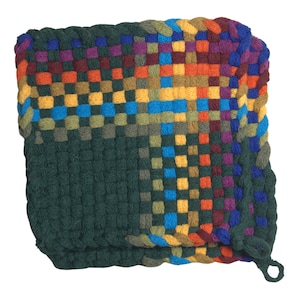 May include: A square, woven potholder in a patchwork design. The potholder features a dark green base that transitions into a colorful pattern of squares in shades of blue, orange, yellow, purple, and green. A loop is attached for hanging.