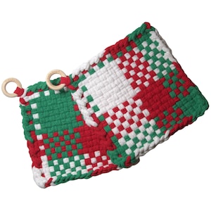 May include: A woven potholder in a red, white, and green checkered pattern. The potholder has two wooden rings attached for hanging. The color scheme is reminiscent of Christmas.