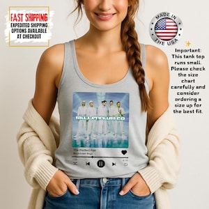 May include: A light gray tank top featuring a graphic of the Backstreet Boys album "Millennium". The graphic includes the album title, song title "The Perfect Fan", and a music player interface. The tank top is made in the USA.