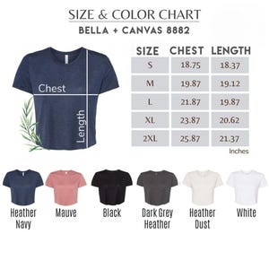 May include: A navy blue Bella + Canvas 8882 t-shirt with a size and color chart. The chart shows chest and length measurements in inches for sizes S to 2XL. Additional shirt colors include mauve, black, dark grey heather, heather dust, and white.