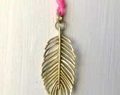 Alexa Feather Pendant in 18k Gold on Fluro Pink Nylon String.  Sacred Artisan Feather to Communicate with Your Higher Power.