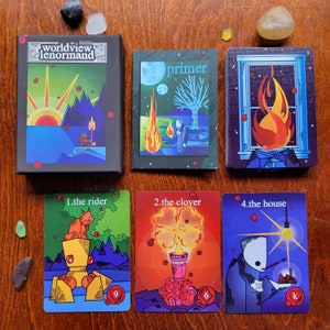 May include: A set of ten tarot cards with colorful illustrations and text. The cards are arranged in two rows of five. The top row includes the cards "Worldview Lenormand", "Primer", "The House", "The Rider", and "The Clover". The bottom row includes the cards "The Rider", "The Clover", "The House", "The Rider", and "The Clover".