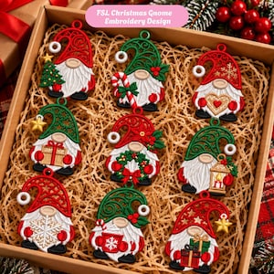 May include: A collection of nine FSL Christmas gnome embroidery designs arranged in a box. Each gnome features a white beard, a red or green filigree hat, and holds festive items like a Christmas tree, candy cane, heart, gift, wreath, lantern, or snowflake.