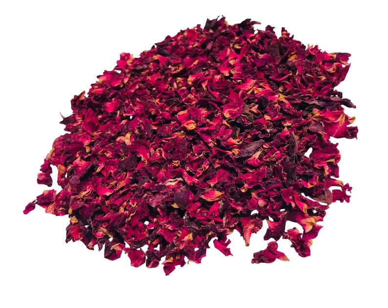 May include: A pile of dried rose petals, predominantly deep red with hints of yellow and brown. The petals are irregularly shaped and appear to be naturally dried, suitable for potpourri, crafts, or other decorative uses.