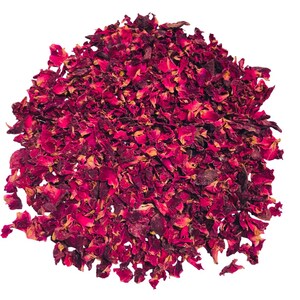May include: A pile of dried rose petals in shades of deep red and burgundy, with hints of yellow and brown. The petals are irregularly shaped and appear to be loose, creating a textured, natural look. Ideal for potpourri or crafting.