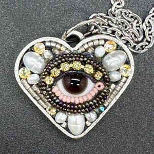 Small Eye Heart Pendant Necklace by Betsy Youngquist (brown)