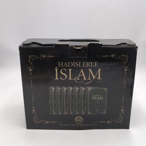 May include: A black box set of books titled "HADISLERLE ISLAM" with gold decorative accents. The box contains multiple green books, with the title visible on the spine. The box also features the text "DIYANET ISLERI BASKANLIGI".