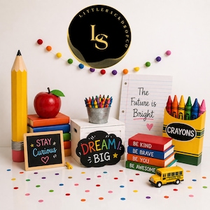 May include: A colorful back-to-school themed display featuring a large yellow pencil, a red apple, and a stack of books. A chalkboard reads "Stay Curious." A sign says "Dream Big." A box of crayons and a yellow school bus are also present.