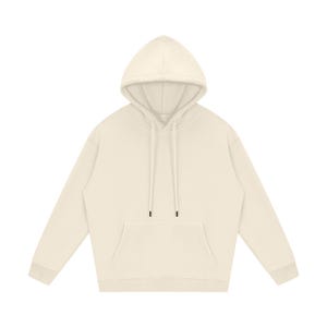 May include: Cream-colored hoodie with a drawstring hood and a kangaroo pocket. The long-sleeved sweatshirt has ribbed cuffs and hem. The neutral-toned garment is made of a soft, comfortable material.
