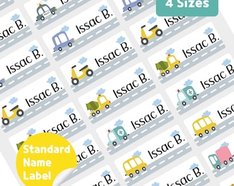 May include: Sheet of personalized name labels featuring various cartoon vehicles like police cars, ambulances, and scooters. Each label includes the name "Issac B." and is set against a road and cloud background. The labels are available in 4 sizes.