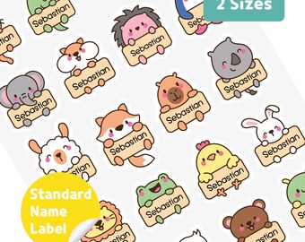 May include: A sheet of colorful stickers featuring various cartoon animals, each holding a sign with the name "Sebastian." The stickers include a crocodile, penguin, hedgehog, elephant, hamster, fox, and more. The text "2 Sizes" and "Standard Name Label" are also visible.
