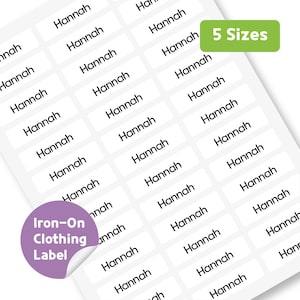 May include: White iron-on clothing labels printed with the name "Hannah" in black. A green rectangle indicates "5 Sizes". A purple sticker reads "Iron-On Clothing Label".