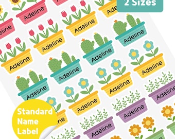 May include: Sheet of stickers featuring colorful potted plants with the name "Adeline" on each pot. The plants include sunflowers, tulips, cacti, and other flowers. The text "2 Sizes" and "Standard Name Label" are also visible.