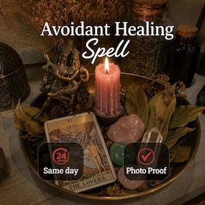 May include: A brass tray containing a bronze-colored figurine of two figures, a pink pillar candle, dried leaves, a clear quartz point, a green stone, a pink stone, and a tarot card labeled The Lovers with text reading Avoidant Healing Spell.