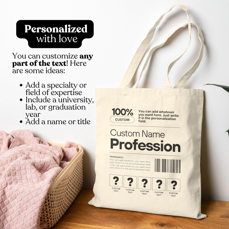 May include: A cream-colored tote bag with black text that reads "Custom Name Profession." The bag includes text that says "Personalized with love" and "You can customize any part of the text!" The bag has a barcode and question marks.
