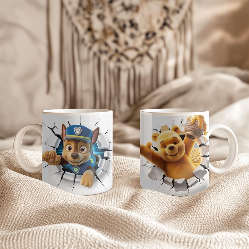 May include: Two white ceramic mugs featuring cartoon characters. One mug showcases Chase from Paw Patrol, breaking through a wall. The other mug features Winnie the Pooh with a honey pot. Both mugs have white handles.