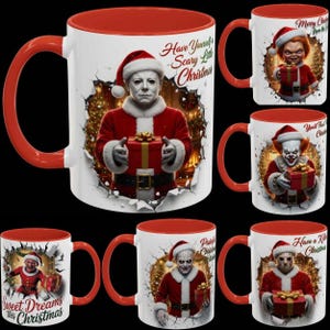 May include: White ceramic mugs with red interiors and handles, featuring horror movie characters dressed as Santa Claus. Each mug has a unique design with text like "Have Yourself a Scary Little Christmas" and "Sweet Dreams this Christmas."