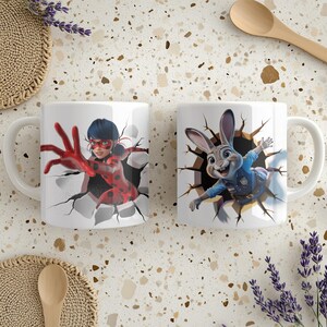 May include: Two white ceramic mugs with cartoon character designs. One mug features a red and black spotted character, and the other depicts a smiling rabbit in a police uniform. Both designs appear to be breaking through a wall.