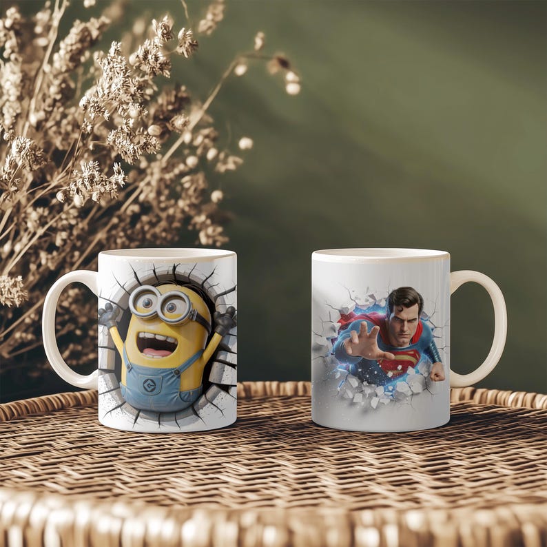May include: Two white ceramic mugs with cartoon graphics. One mug features a Minion character breaking through a wall, and the other depicts Superman breaking through a wall. Both mugs have white handles.